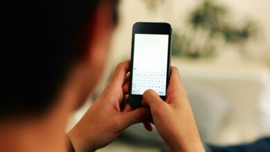 Closeup portrait of a man using smartphone